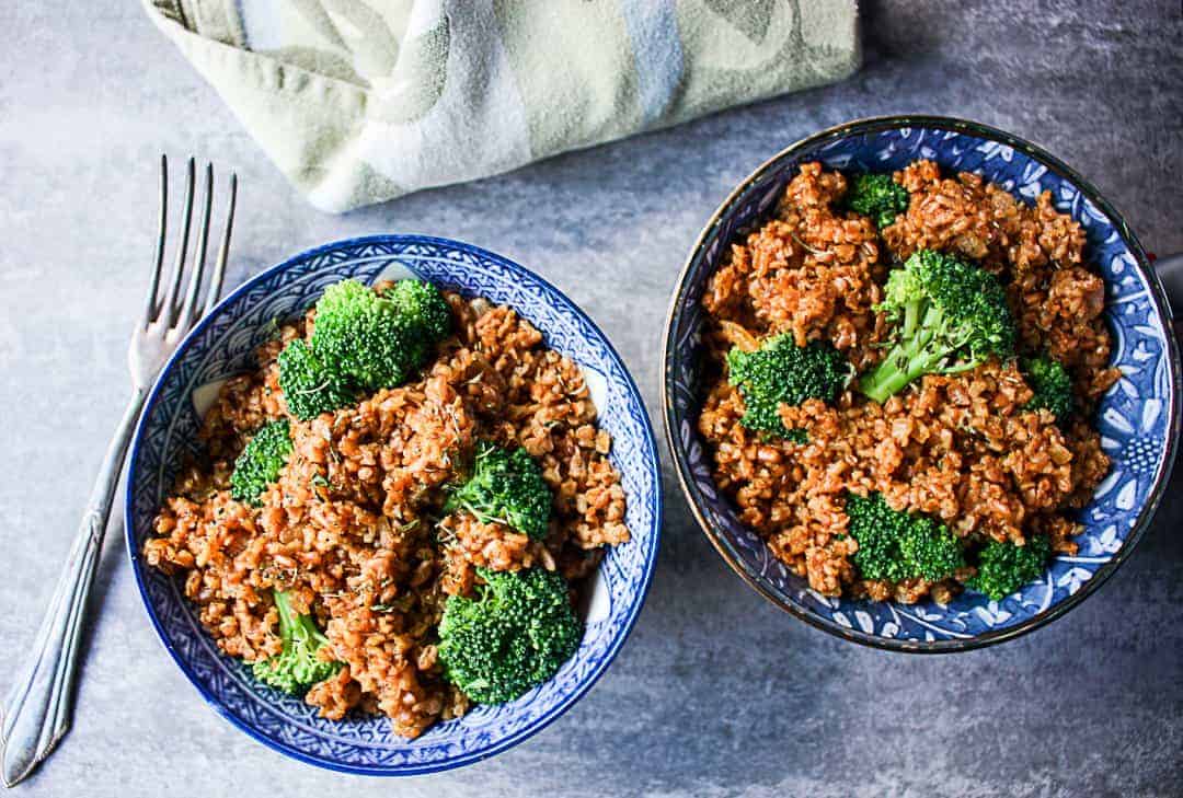 A plate of food with broccoli, and bulgur