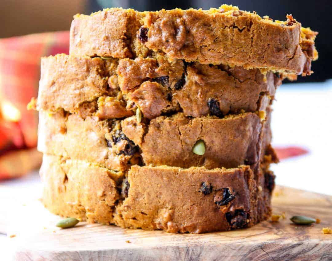 Four slices of pumpkin loaf, stacked