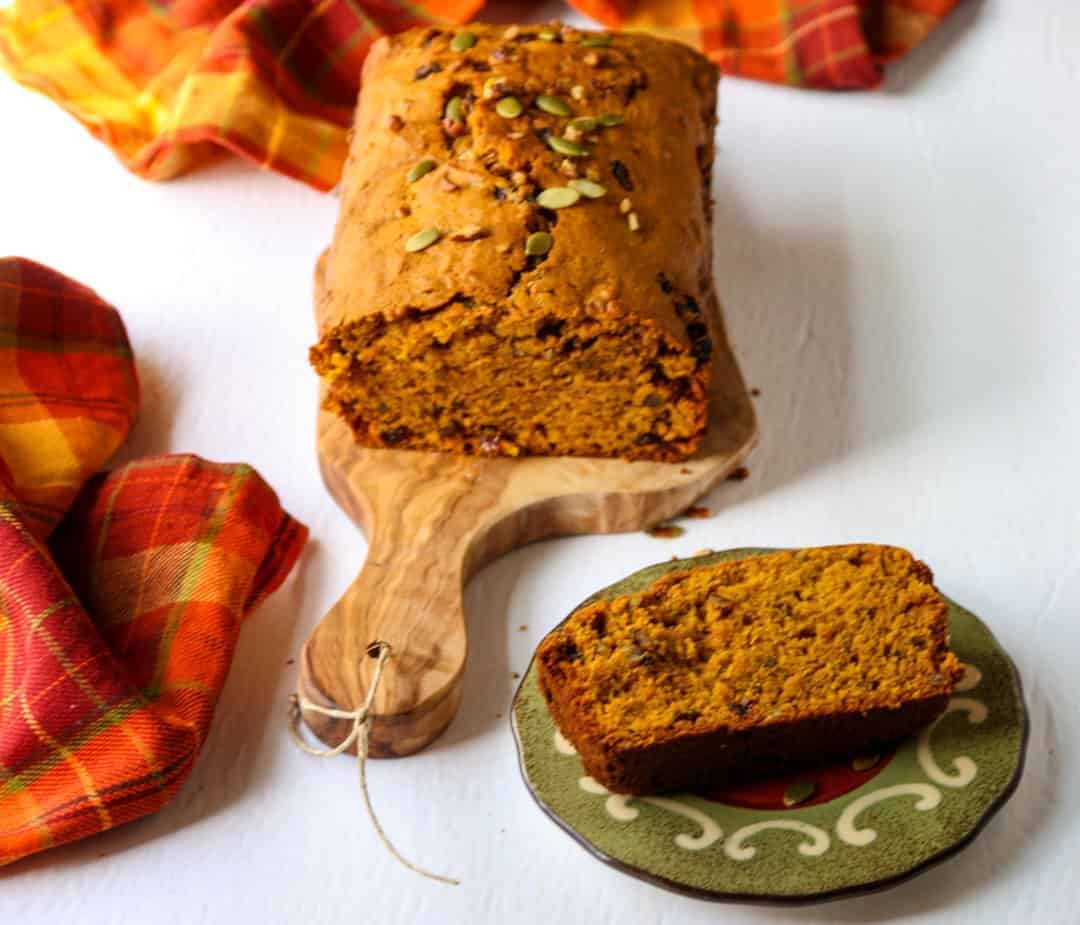 A piece of pumpkin bread on a plate