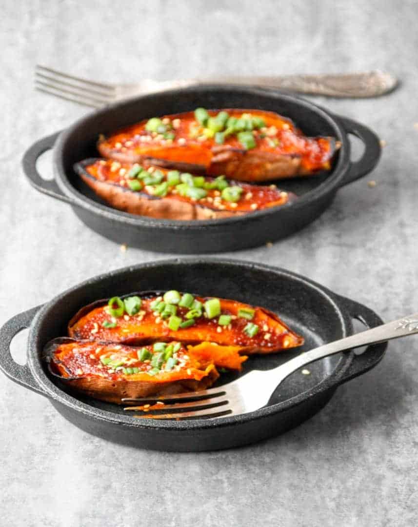 Two pans of food with two forks