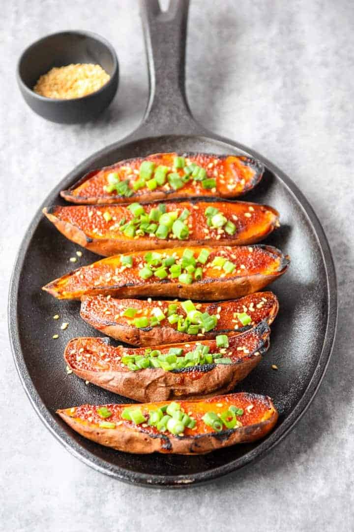 A pan of roasted sweet potatoes on a table