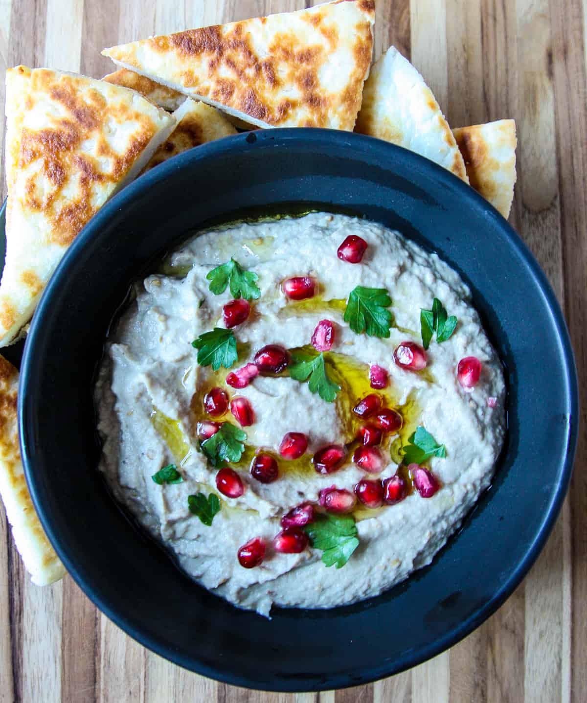 Mutabbal Dip in a black dish.